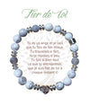 Bracelet Earth Angel « Fier de toi » à perles blanches et grises, avec sa présentation en français.