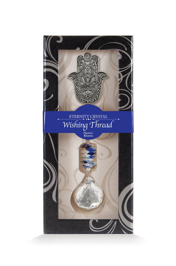 Fil à vœux Hamsa Eternity Crystal présenté dans sa boîte illustrée avec son cristal facetté.
