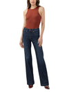 Model wearing Maison Taïga Avery high-waisted dark indigo trouser jeans with a flared leg in flexible knit denim.