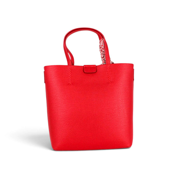 Sac à main Maison Taïga Charme rouge en cuir grainé avec anses et sangle amovible pour un porté épaule pratique.