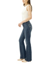 Maison Taïga Silver Jeans Co. Suki mid-rise dark indigo bootcut jeans worn by a woman in a side profile view