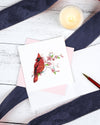 Carte de vœux cardinal rouge et fleurs de cerisier en papier roulé